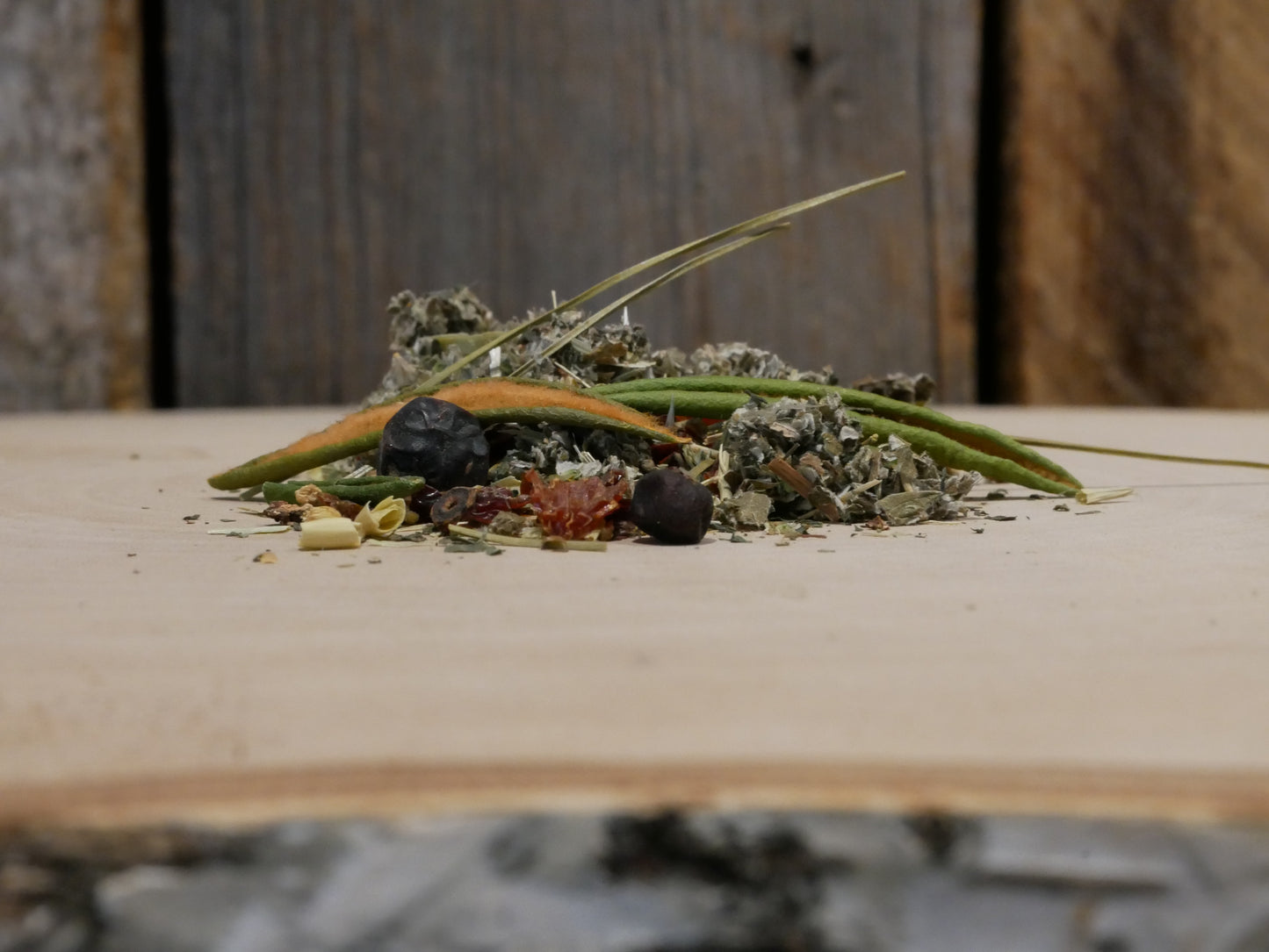 Profile of a sexy tea pile on a faded birch tree piece with old barn wood in back ground.